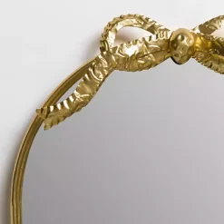 Kirklands Home Decorative Mirrors|Oval Gold Bow Metal Wall Mirror