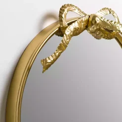 Kirklands Home Decorative Mirrors|Oval Gold Bow Metal Wall Mirror